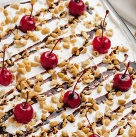 Delicious Banana Split Cake with layers of cake, ice cream, and toppings