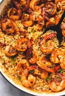 Plate of Cajun shrimp served with seasoned rice