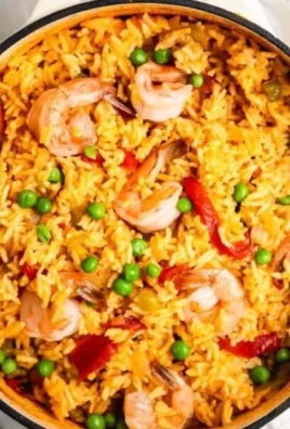 Plate of Cuban shrimp with rice, showcasing vibrant colors and delicious ingredients.