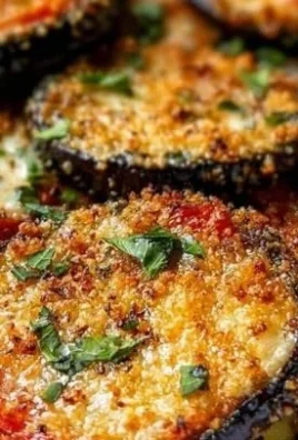 Delicious homemade Eggplant Parmesan with layers of cheese and marinara sauce.