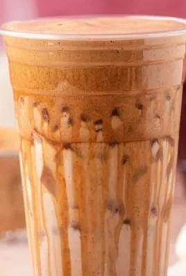 French Toast Iced Latte garnished with whipped cream and cinnamon