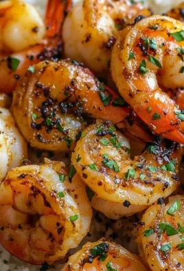 Delicious garlic butter shrimp served on a plate with rice