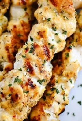 Delicious Garlic Parmesan Chicken Kebabs on a grill