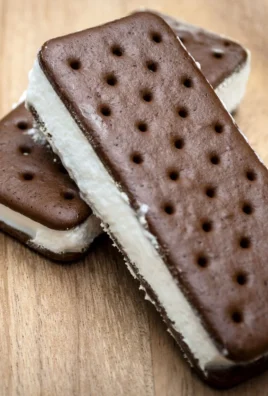 Delicious homemade ice cream sandwich filled with creamy ice cream and cookie layers.