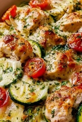 Mediterranean Chicken Zucchini Bake served in a dish with fresh herbs