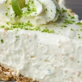 Delicious no bake key lime pie topped with whipped cream and lime slices