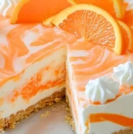 No-bake orange creamsicle cheesecake topped with orange slices