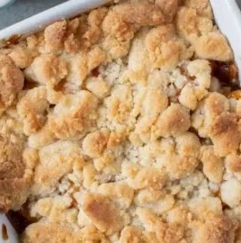 Delicious peach cobbler for two served in a small dish