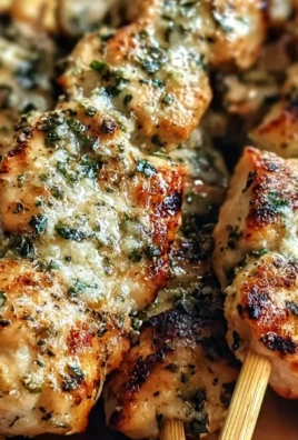 Savory garlic parmesan chicken skewers grilled to perfection for summer meals.