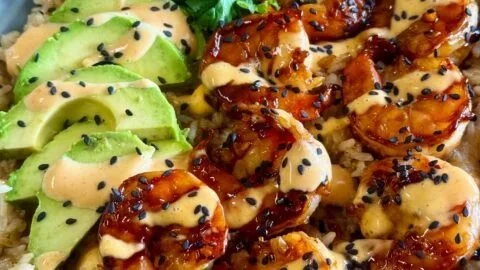 Teriyaki shrimp rice bowl with fresh vegetables and savory sauce