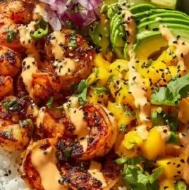 Delicious charred shrimp bowl with avocado and colorful toppings