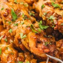 Crispy Air Fryer Bang Bang Chicken garnished with green onions