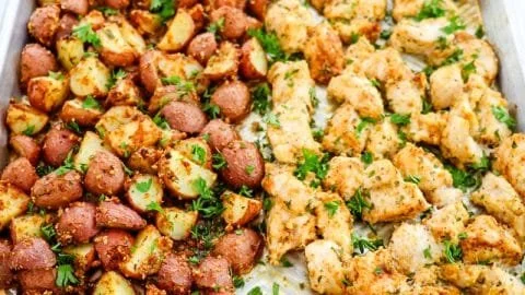 Baked Garlic Parmesan Chicken served with seasoned potatoes on a plate