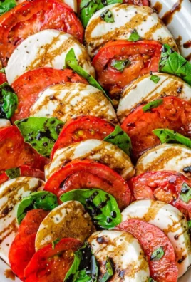 Fresh Caprese Salad with tomatoes, mozzarella, and basil on a plate