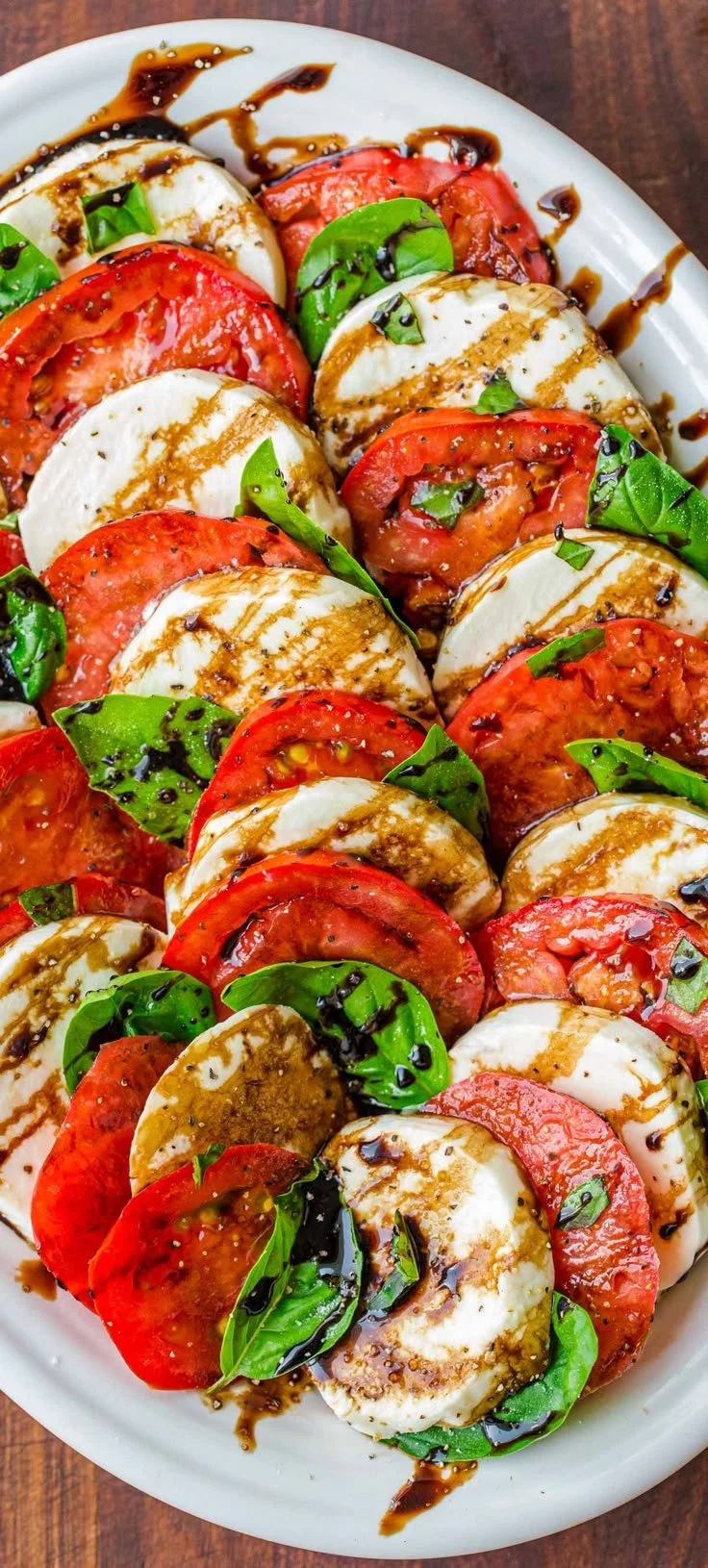 Fresh Caprese Salad with tomatoes, mozzarella, and basil on a plate