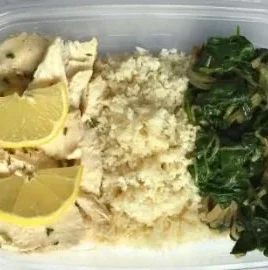 Healthy chicken meal with cauliflower and spinach on a plate