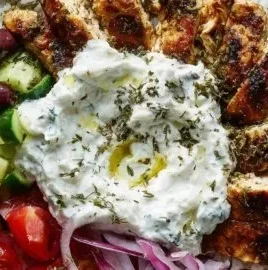Delicious Chicken Gyro Bowls with fluffy rice and creamy tzatziki sauce.