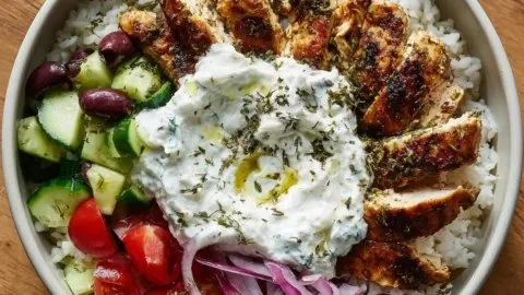 Delicious Chicken Gyro Bowls with fluffy rice and creamy tzatziki sauce.
