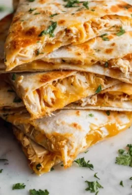 Delicious homemade Chicken Quesadillas served with salsa and sour cream