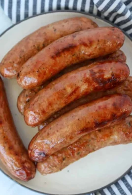 Cooked chicken sausage in the air fryer on a plate