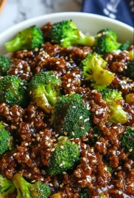 A bowl of hamburger meat and broccoli stir-fry, showcasing a healthy meal option.