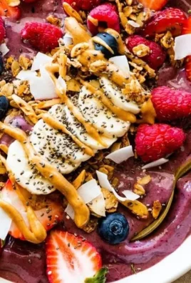 High protein acai bowl topped with fresh fruits and nuts