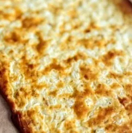 High protein gluten-free cottage cheese flatbread on a wooden board