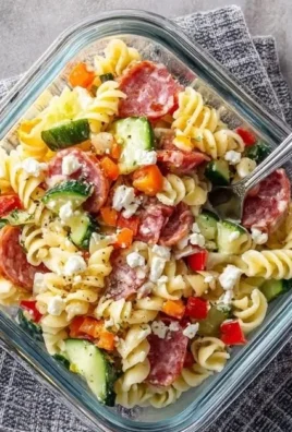 High-protein Italian pasta salad with fresh vegetables and herbs