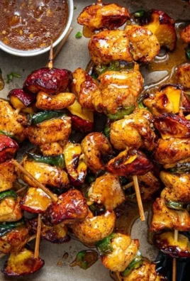 Grilled Jalapeno Peach Chicken Skewers served on a platter