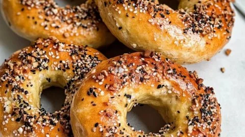 Freshly baked low-carb Greek yogurt bagels on a wooden table