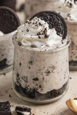Delicious No Bake Oreo Cheesecake Cups topped with crushed Oreos