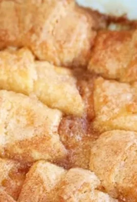 Delicious Peach Cobbler Dumplings with fresh peaches and golden pastry