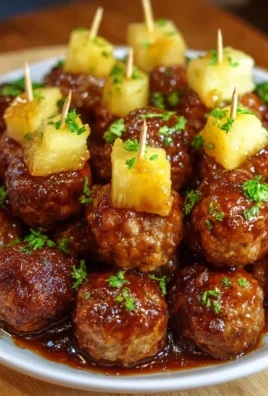 Pineapple brown sugar meatball bites on a serving platter