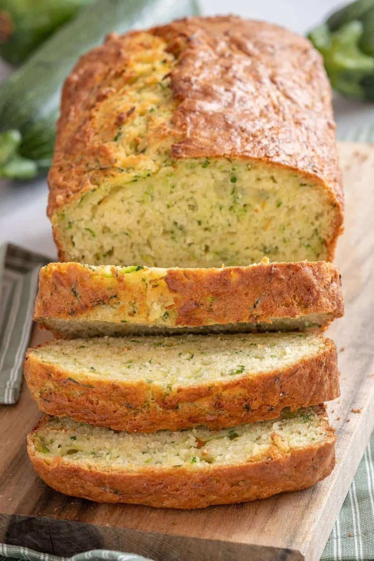 Freshly baked Pioneer Woman zucchini bread loaf on a kitchen counter.
