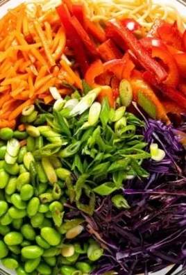 Delicious sesame noodle salad with colorful vegetables and sesame dressing