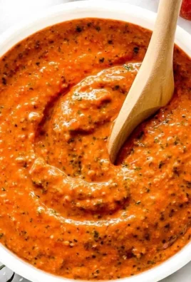 Bowl of Sicilian tomato pesto with fresh ingredients