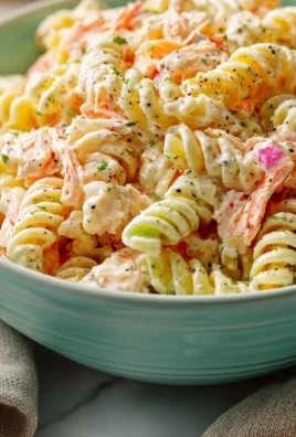 Simple crab pasta salad with ranch dressing, colorful ingredients in a bowl.