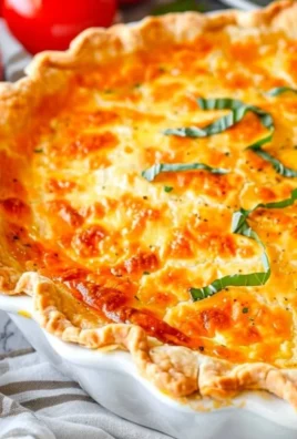 Delicious Southern Tomato Pie garnished with fresh herbs and tomatoes
