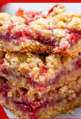 Delicious Strawberry Butter Bars topped with fresh strawberries and cream.