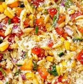 Colorful Summer Orzo Pasta Salad with fresh vegetables and dressing